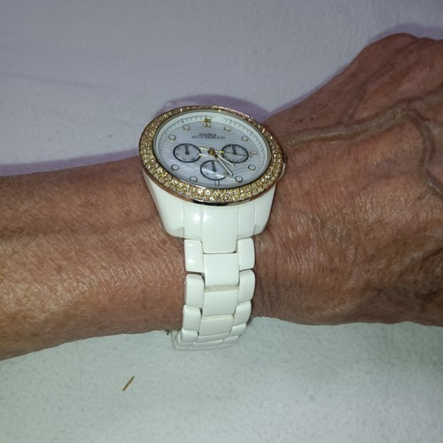 Dana buchman timepiece with - with, a