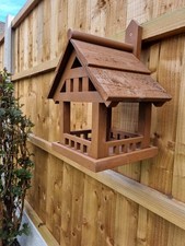 Fence hanging bird table 