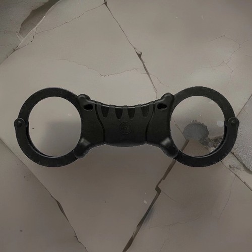 All black rigid handcuffs high - all,