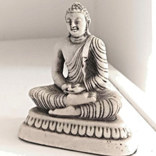 Miniature stone desktop/dashboard meditating Buddha