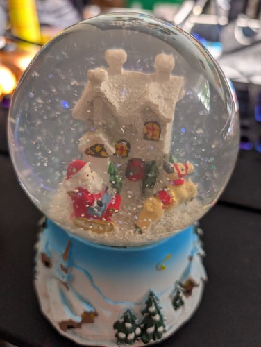 Musical snow globe plays - snow,