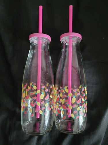 Pink milk bottles with - milk,