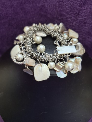 Silver tone charm - &, of