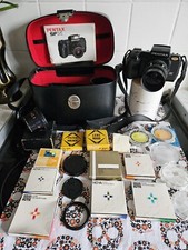 Pentax SFX SLR 35mm Film Camera + 35-70mm Lens. Case And Lots Of Extras Hoya Ect