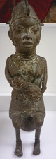African Bronze Benin  female figure of status bearing a gourd