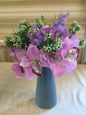 artificial silk flowers arrangement in vase,  lilac orchid with greenery 