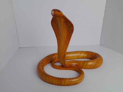 Carved wooden cobra snake