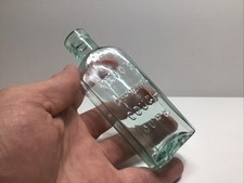 Small Antique Aqua Veno’s Lightning Cough Cure Medicine Bottle.