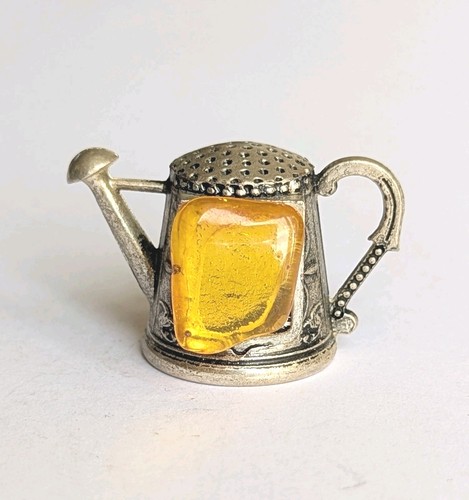 Ornate metal watering - ornate,