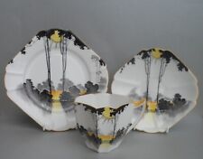 A Shelley "Sunrise & Tall Trees" 11678 Tall Queen Anne shape tea trio. C.1929.