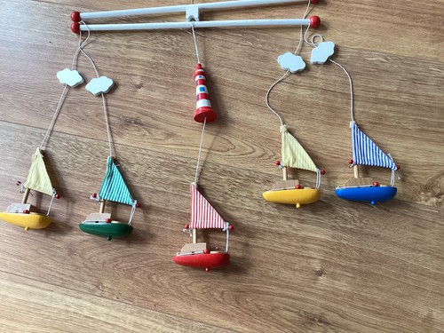 Wooden lighthouse and sailing