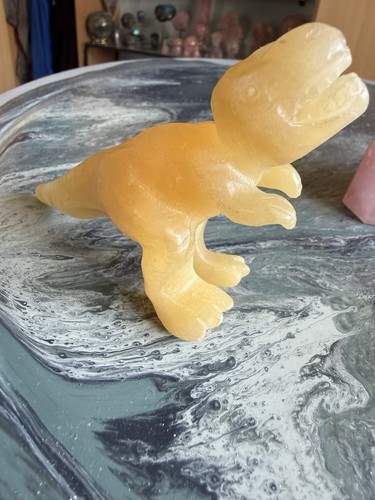 Yellow orange calcite t rex - /,