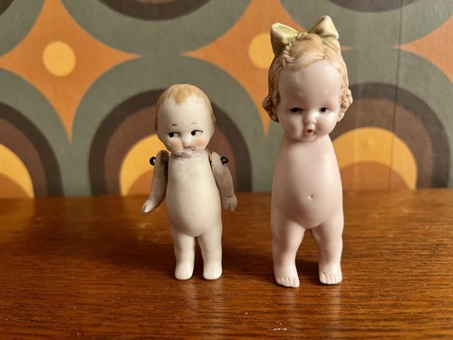 Pair vintage all bisque - of,