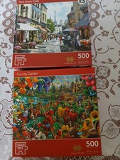 2 500CORNER PIECE JIGSAWS-COUNTRY GARDEN(COMPLETE)/PARIS STREET CAFES(1 MISSING)