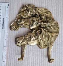 A LARGE,  RUSTIC BRASS HORSE'S