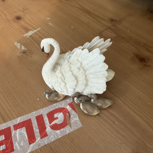 Swan and cygnets - figurine, the