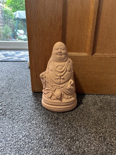 Happy sitting stone