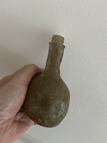Old deformed glass bottle - glass,