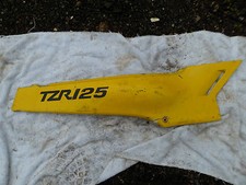 Fairing side panel for a TZR