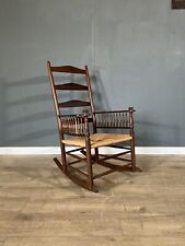 A very stylish mahogany rocking chair in the shaker style