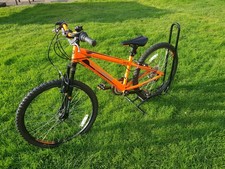  team mountain bike. 22.5 inches wheel size. Orange coloured.