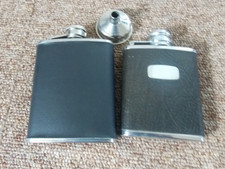 2 small hip flasks and a funnel