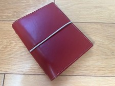 Small red leather filofax, unused but aged