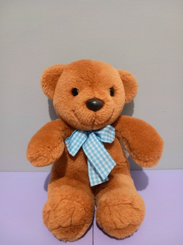 Small brown teddy bear with - small,