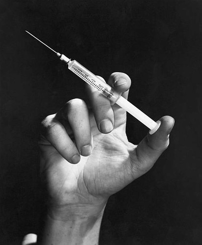 Hand holding hypodermic - hand,