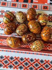 ELEVEN WOODEN UKRAINIAN PYSANKY EGGS