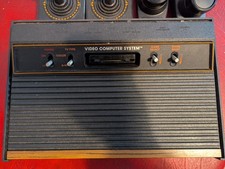 ATARI 2600 Black video computer system console with joysticks and paddles