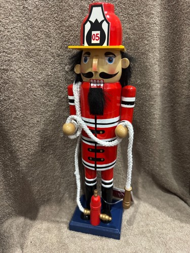 Wooden fireman with - fireman, hose