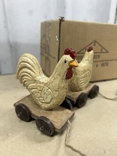 Decoration set of two wooden carved cook/Hen on scooter stone the crows 