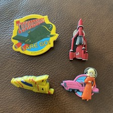 4 x Vintage Thunderbirds Pin Badges, 3 rubber 3D pin badges, 1 card badge ex con