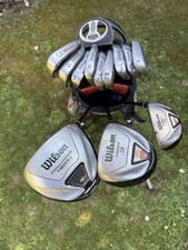 MIXED SET OF RIGHT  HANDED WILSON GOLF CLUBS IN A CALLAWAY STAND BAG. FREE POST