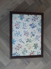 A lap tray with flower and