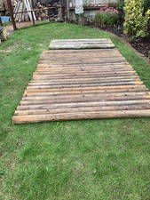 £200 For 25 X 190cm X 10cm And 7 X 180cm X 10cm Round Wooden Posts - used.