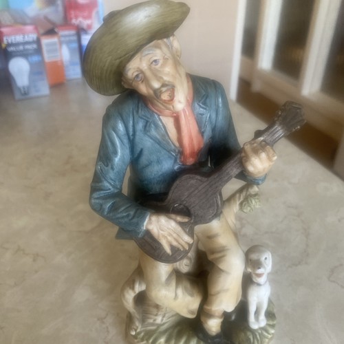 Old man playing guitar - playing,