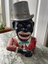 Antique Jolly man mechanical cast iron bank in original complete condition.
