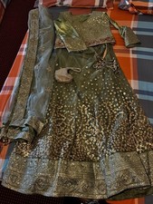 Green Full Length Lengha Party Wear With A Dubatta And A Bag.