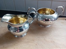 Superb gilded inner silver plated sugar bowl and matching cream jug pair.