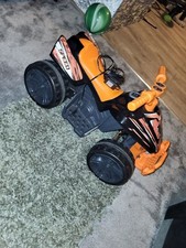 Orange And Black Kids Quad Bike. Used. charger comes with it.