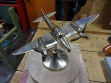 A Brass Mosquitp Aircraft.