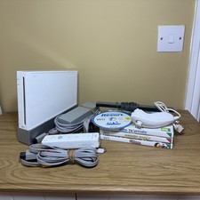 Nintendo Wii + Wii Sports Resort & Party Games Bundle