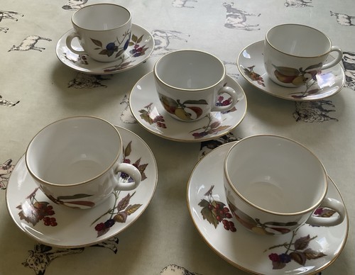 Five tea cups and - five, in