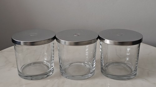 Empty candle jars with - candle,