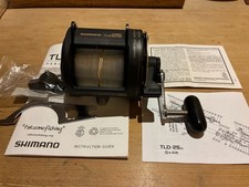 Shimano TLD 25 Multiplier Sea Fishing Reel.  Unused, complete, box, tool, clamp.