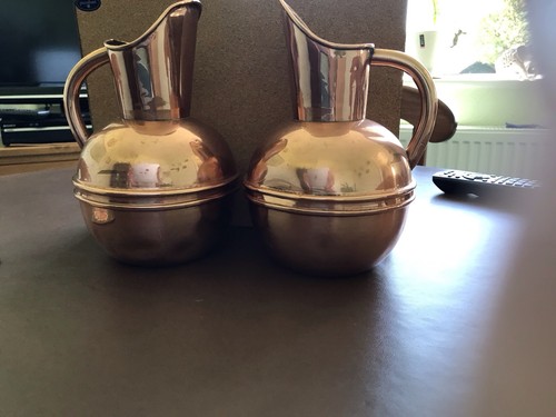 Pair antique copper water - of,