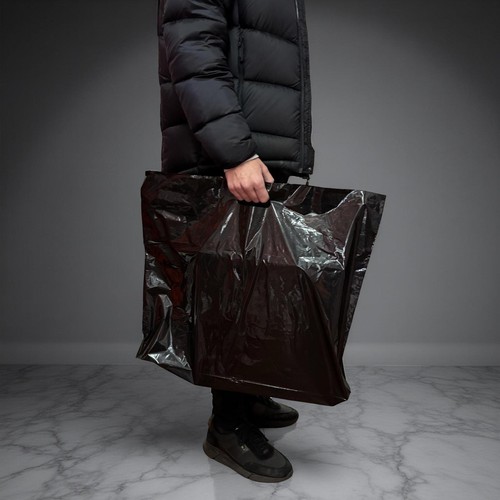 Black plastic shopping carrier - shopping,