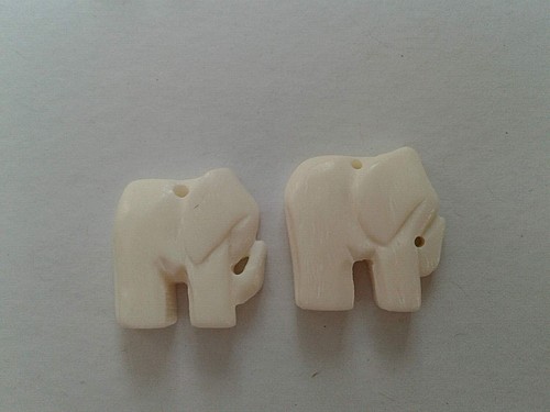 White hand carved elephant - hand,